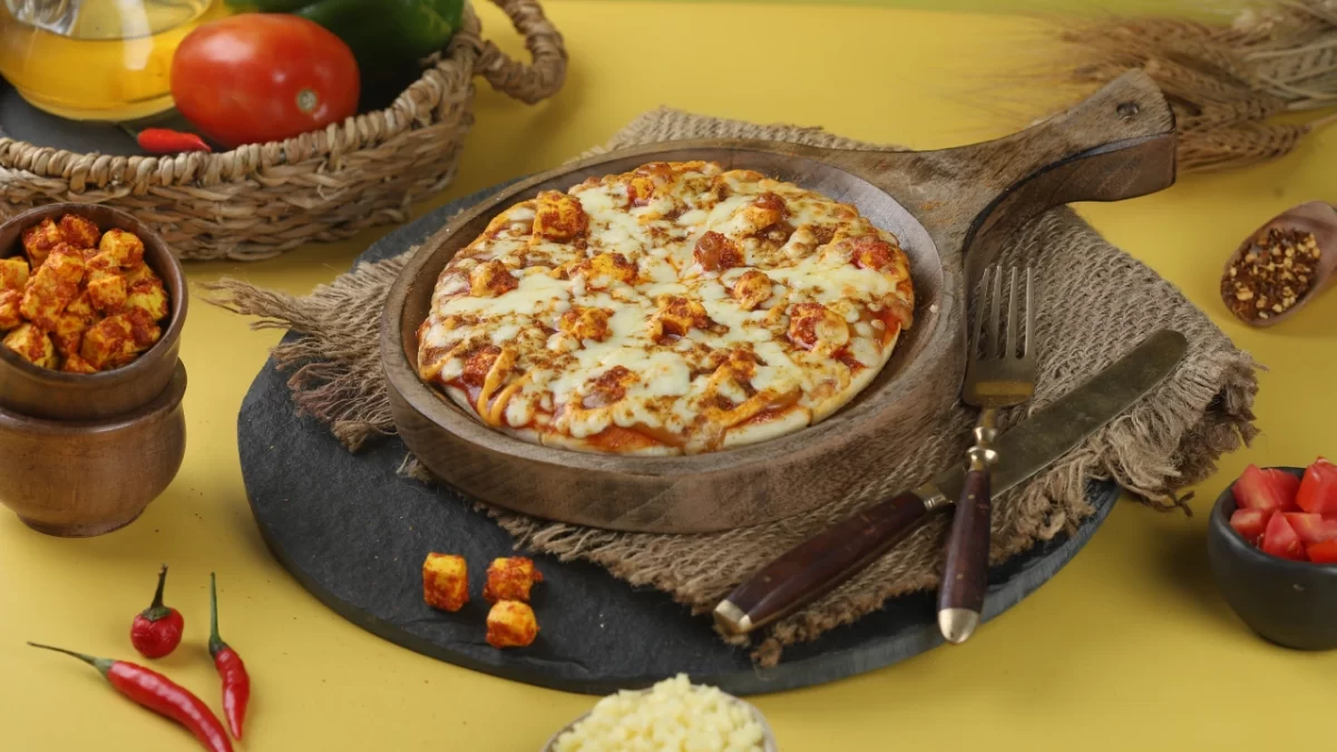 Image of a delicious pizza loaded with cheese and toppings