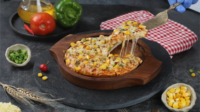 Image of Ajay’s delicious cheesy pizza