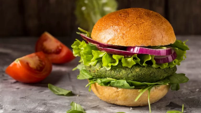 Classic burger featuring simple ingredients like lettuce, tomato, cheese and a juicy patty.