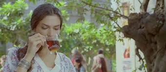 Meera (played by Deepika Padukone) from the movie Love Aaj Kal sipping black coffee.